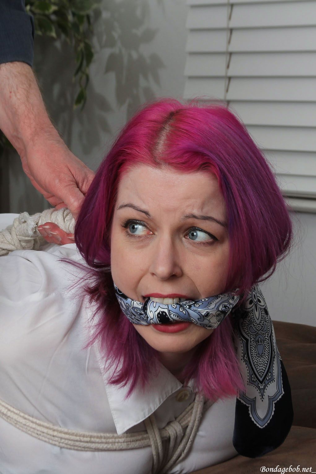 Temptress Kate in bondage.