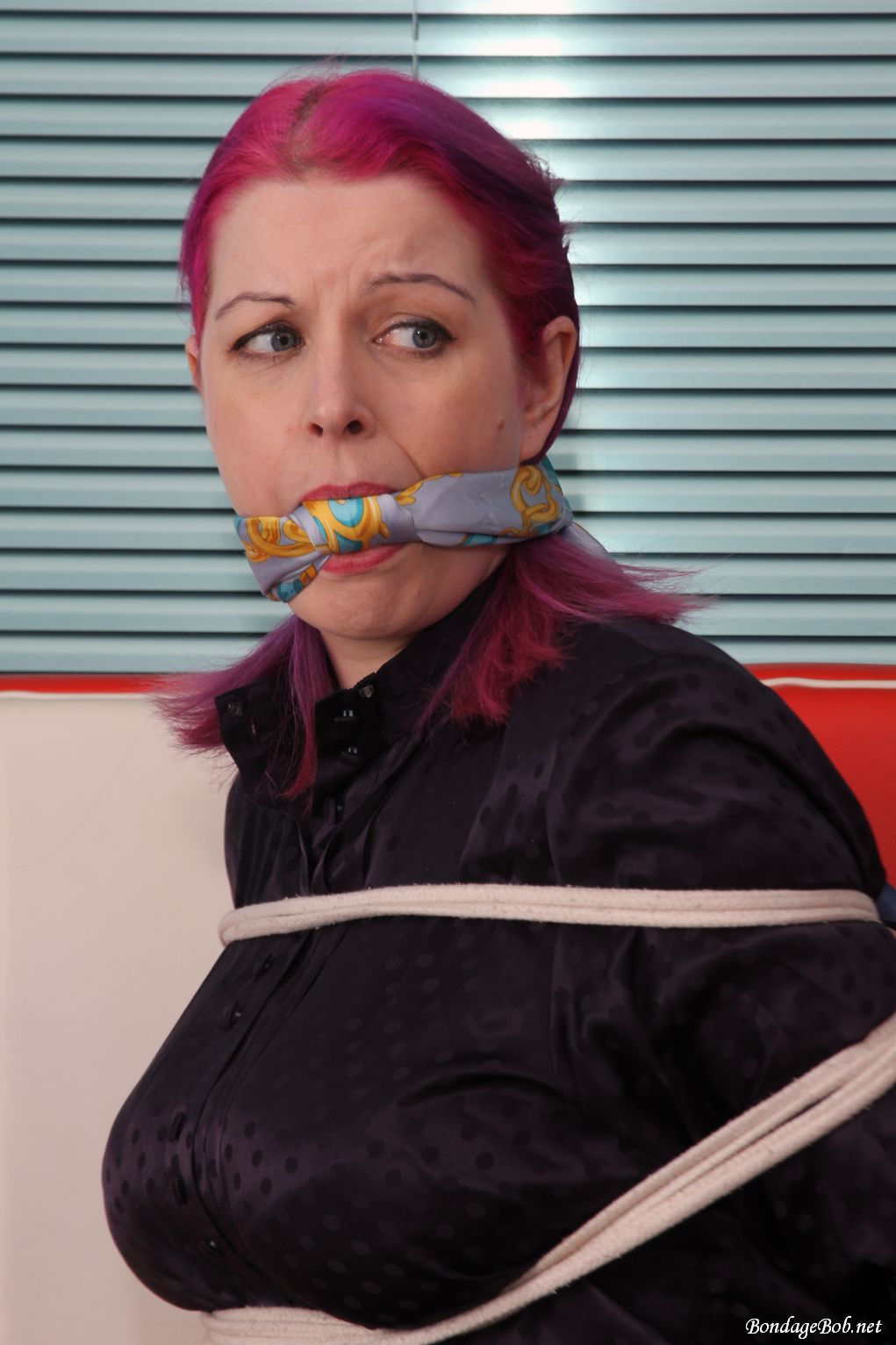 Temptress Kate in bondage.